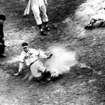 October 15, 1946: Enos Slaughter of the St. Louis Cardinals slid home with what would be the winning run in game seven of the World Series. Slaughter scored all the way from first base on Harry Walker’s double to left center. Johnny Pesky, the Red Sox shortstop, hesitated on the throw as Slaughter ran. Pesky said later, “I couldn’t hear anybody. There was too much yelling. It looked like an ordinary single. I thought he’d hold up at third so late in the game.” The Cardinals won the World Series in this seventh game 4-3.